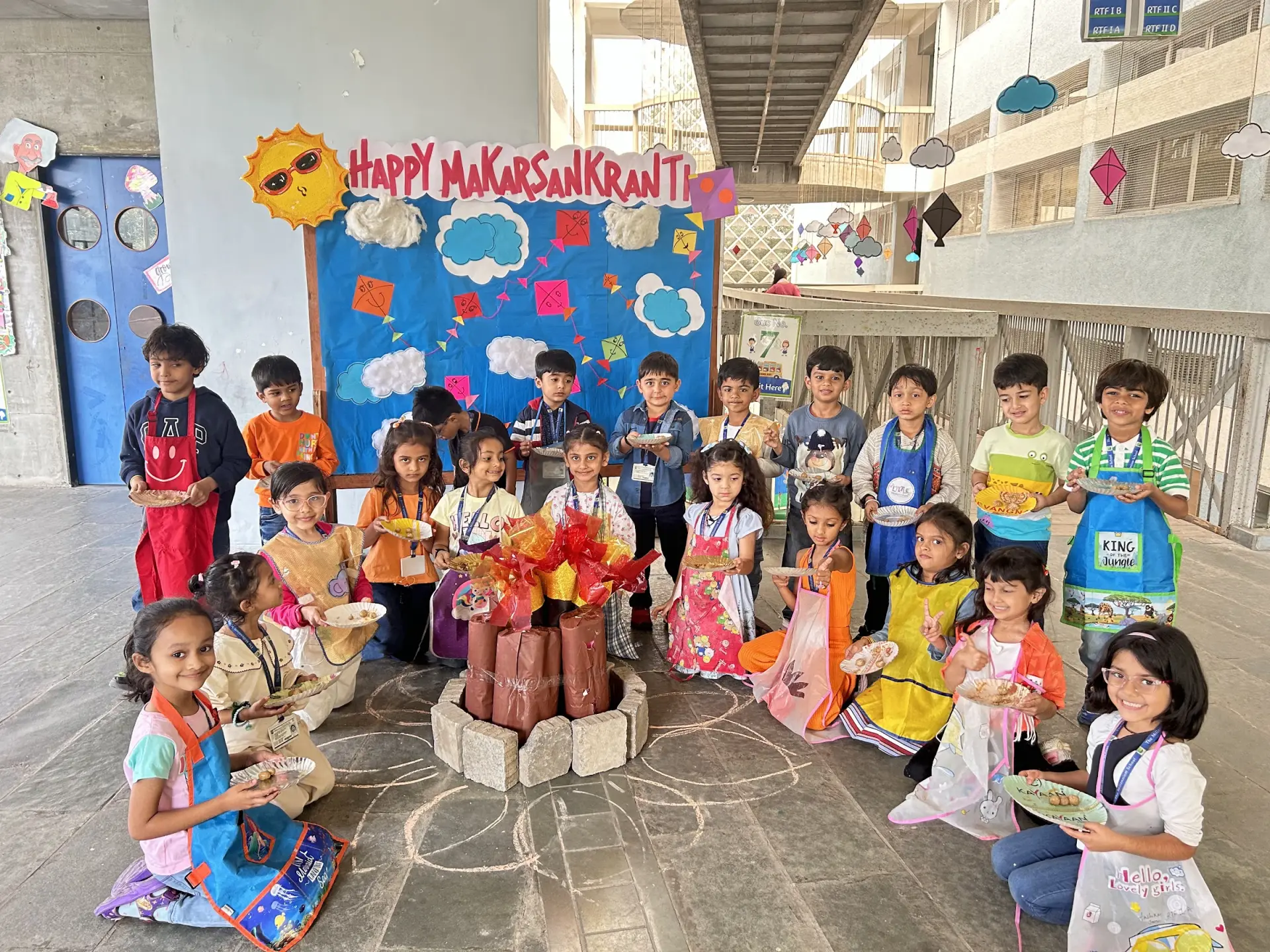 Students celebrating on stage at The Mindcrest School