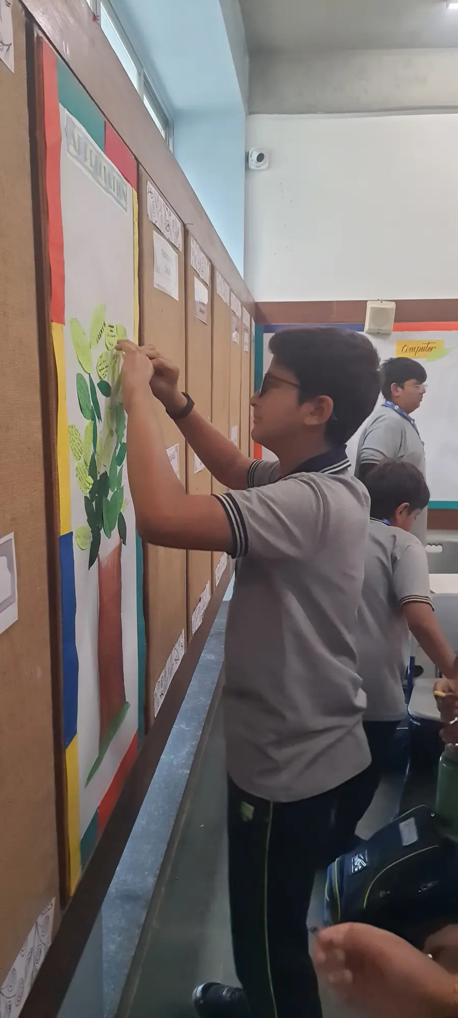 Students painting a classroom mural