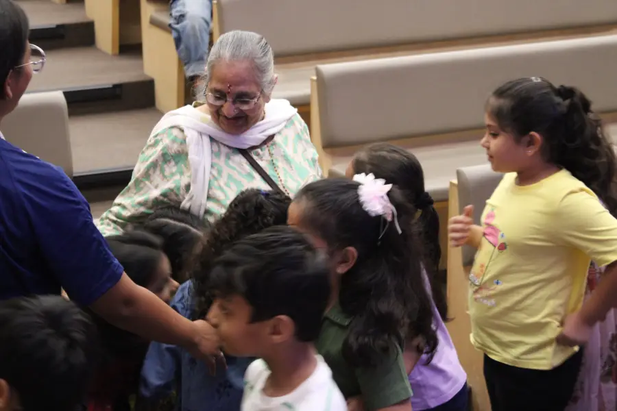 A child with a grandparent during a school visit